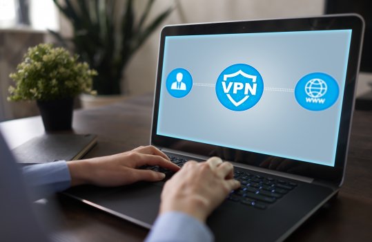 man on laptop typing vpn on monitor vpn services hotspot shield anchorfree